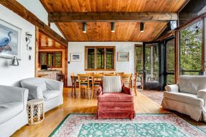 a living room with a table and chairs at Beebe Lake House in Castleton