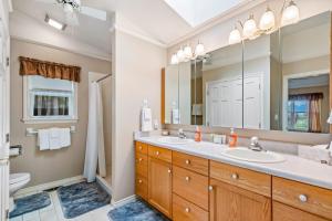 a bathroom with two sinks and a large mirror at The Wild Rose in Sagle +56 photos