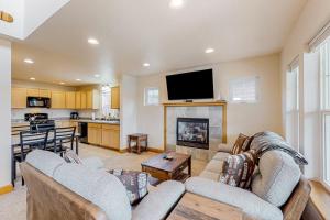 a living room with two couches and a fireplace at Dover Delight in Dover