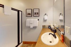 a bathroom with a sink and a mirror at Whiplash in Sandpoint +48 photos