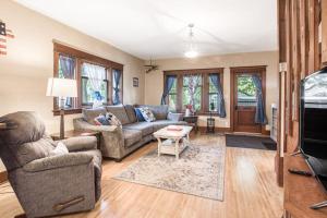 a living room with a couch and a table at South Sandpoint Charmer in Sandpoint