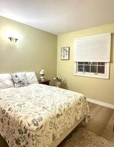a bedroom with a bed and a window at Private Guest Suit-Self Checkin-Near Downtown in Charlottetown