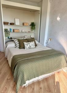 a bedroom with a large bed in a room at Oasis de Málaga in Chilches