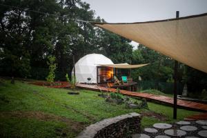 a large white dome tent in a yard at Willkay Glamping in Tafí Viejo