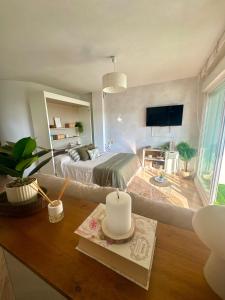 a bedroom with a bed and a table in a room at Oasis de Málaga in Chilches