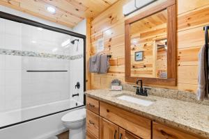 a bathroom with a toilet and a sink and a shower at Beside Still Water 2 in Cosby +38 photos