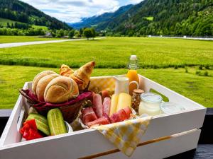 a box of food with bread and other foods at Ski Vital Apartments in Sankt Michael im Lungau