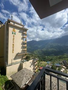 a building with a sign on the side of it at TIME Restaurant & Homestay Sa Pa in Sapa
