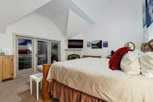 a bedroom with a large bed and a television at The Rest in Jackson