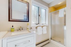a white bathroom with a sink and a shower at Tin Mountain Treetops Time in Jackson +65 photos