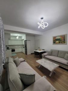 a living room with a couch and a table at Vila Mollanji in Tirana