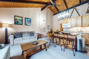 a living room with a couch and a table at Mountain Oasis in Bartlett