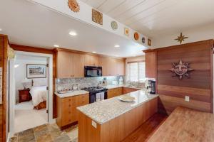 a kitchen with wooden cabinets and a counter top at Sun Valley Escape in Sun Valley +50 photos