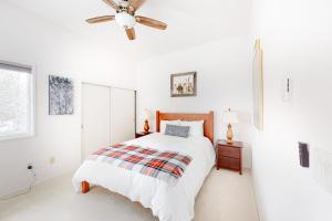 a white bedroom with a bed and a ceiling fan at Valley Gem Entire Home in Sun Valley +66 photos