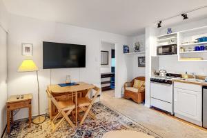 a living room with a table and a kitchen at Valley Gem Entire Home in Sun Valley
