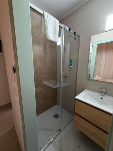 a bathroom with a shower and a sink at Alojamientos LUMARA in Peal de Becerro +14 photos