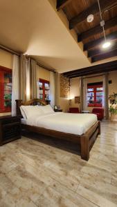 a bedroom with a large bed in a room at QUINTA SEIS TRES in Bogotá