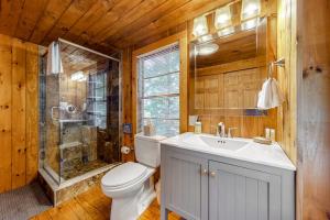 a bathroom with a toilet and a shower and a sink at Maggie in Wakefield +47 photos