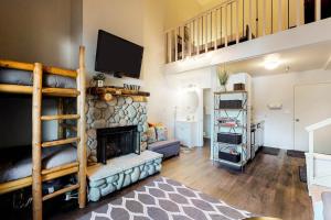 a living room with a fireplace and a tv at Elkhorn Escape in Sun Valley +43 photos