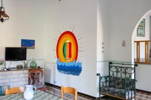a living room with a painting on the wall at Villa Troianiello in Carano