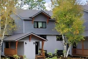 a house with a white garage at Okemo Village B5 in Ludlow