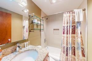 a bathroom with a sink and a shower at Okemo Village B5 in Ludlow +48 photos