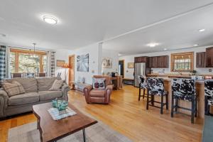 a living room with a couch and a table at Gondola Lodge in Killington