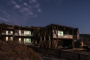 a house on top of a hill at night at Qbos Matanzas in Matanzas