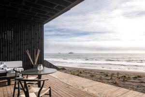 a view of the ocean from the deck of a beach house at Qbos Matanzas in Matanzas +12 photos