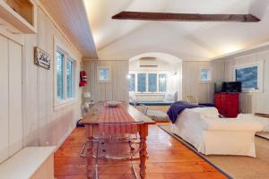 a living room with a table and a couch at Little Red in Wilmington