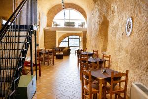 a restaurant with tables and chairs in a room at Il Castello di Atessa in Atessa