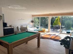a living room with a pool table in it at Villa dolce vita in Nans-les-Pins