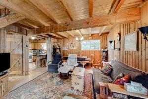 a living room with a couch and a table at Mowing Way Retreat in Wilmington