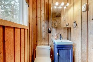 a bathroom with a toilet and a sink at Mowing Way Retreat in Wilmington +46 photos
