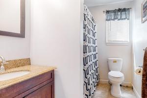 a bathroom with a toilet and a sink at Downtown Beauty - Unit 1 in Conway +28 photos