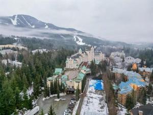 a resort in the mountains with snow on the ground at 31GlenEagle Whistler in Whistler