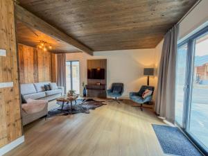 a living room with a couch and a table at Nockberge in Afritz