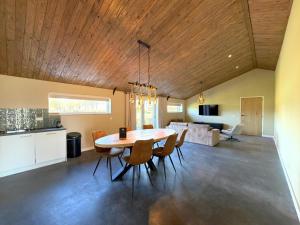 a kitchen and dining room with a table and chairs at Sientjeshof 1 in Diessen