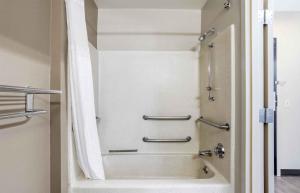 a shower in a bathroom with a tub at Extended Stay America Select Suites - Longview in Longview +18 photos