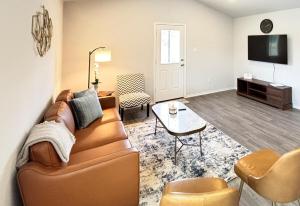 a living room with a couch and a table at Quiet at Pine Branch in Lufkin