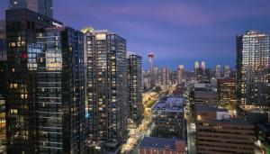 a view of a city skyline with tall buildings at The Alpine City Escape in Calgary