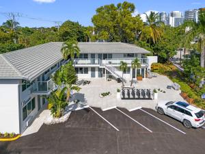 an aerial view of a house with a car parked in a parking lot at Ocean Blvd Two Doubles Suite with Kitchenette in Fort Lauderdale