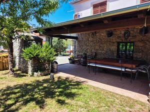 a bench sitting outside of a stone building at Holiday home in Dobrinj - Insel Krk 27652 in Dobrinj
