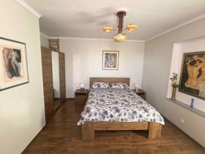 a bedroom with a bed and two end tables at Holiday home in Dobrinj - Insel Krk 27652 in Dobrinj