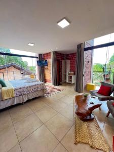 a bedroom with a bed and a couch at Pousada Martins Turismo in Carolina +208 photos