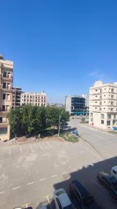 a parking lot with cars parked in a parking lot at 2 BHK Stayloom 218 in Rawalpindi