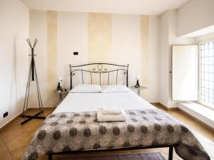 a bedroom with a large bed with a blanket at Il Castello di Atessa in Atessa
