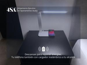 a cell phone sitting on a table in a room at 4StudioAparts RC 04 in Cajamarca
