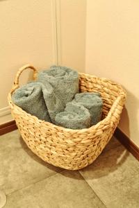a basket filled with towels in the corner of a room at Telegraph in Kamakura +26 photos