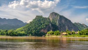 a view of a river with mountains in the background at Luang Prabang Manichan Villa in Luang Prabang